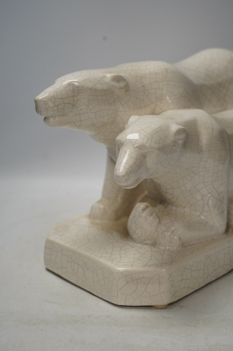 An Art Deco polar bear figure group, 34cm long. Condition - heavily crazed but good